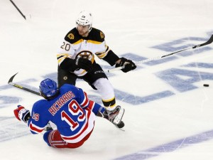 Brad Richards falls in front of Daniel Paille during the second period.