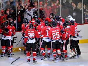 Blackhawks mob Brent Seabrook after he scores the winning goal