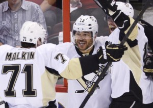 Pittsburgh Penguins' Jarome Iginla (centre) is congratulated by teammates Evgeni Malkin (left) and James Neal after scoring against the Ottawa Senators 